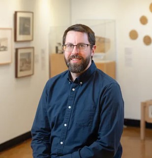 Patrick Heath sitting and smiling